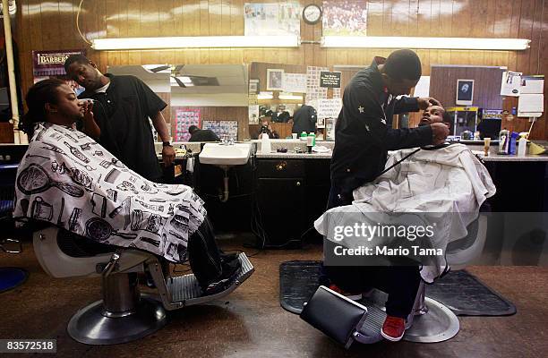 African-Americans get their hair cut in the Civil Rights District November 5, 2008 in Birmingham, Alabama. Birmingham, along with Selma and...