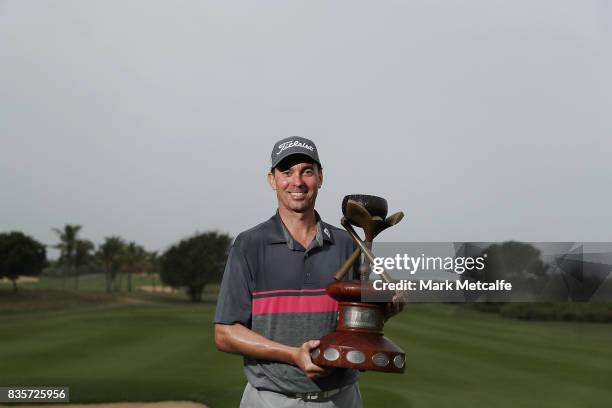 Jason Norris of Australia poses with his trophy after winning on day four of the 2017 Fiji International at Natadola Bay Championship Golf Course on...