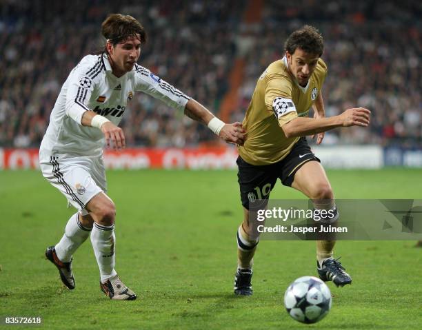Alessandro Del Piero of Juventus duels for the ball with Sergio Ramos of Real Madrid during the UEFA Champions League Group H match between Real...