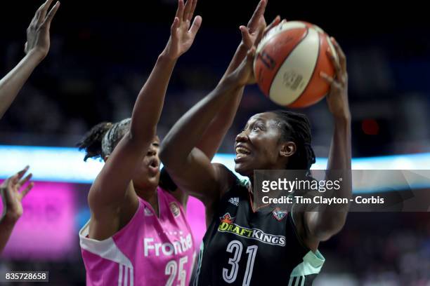 Tina Charles of the New York Liberty shoots while defended by Alyssa Thomas of the Connecticut Sun during the Connecticut Sun Vs New York Liberty,...