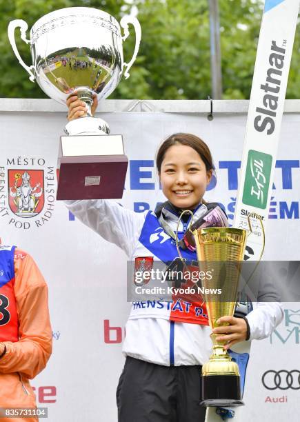 Sara Takanashi of Japan celebrates winning the women's ski jumping summer Grand Prix competition in Frenstat, Czech Republic, on Aug. 19, 2017....