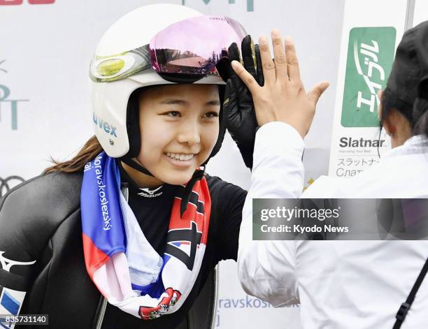 Sara Takanashi of Japan celebrates winning the women's ski jumping summer Grand Prix competition in Frenstat, Czech Republic, on Aug. 19, 2017....