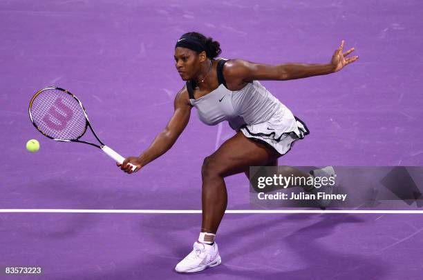 Serena Williams of United States plays a volley in her match against Dinara Safina of Russia during the Sony Ericsson Championships at the Khalifa...