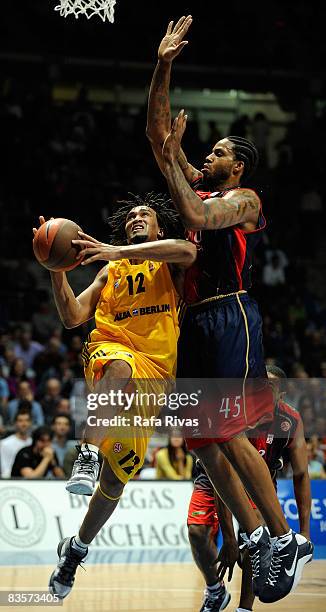 Rashad Wright, #12 of Alba Berlin and Will McDonald, #45 of TAU Ceramica in action during the Euroleague Basketball Game 3 match between Tau Ceramica...