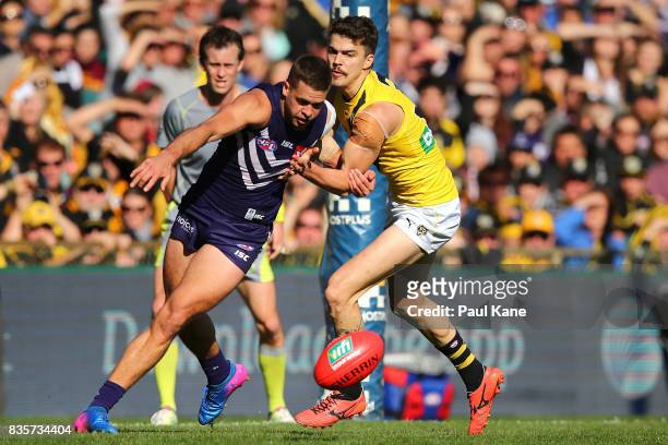 Stephen Hill of the Dockers and Oleg Markov of the Tigers contest for the ball during the round 22 AFL match between the Fremantle Dockers and the...