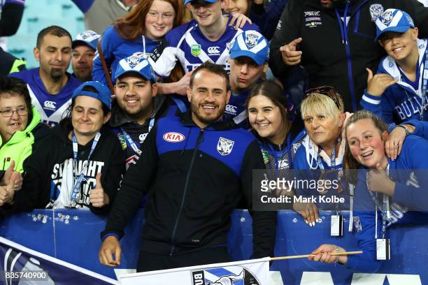 Injured Bulldogs player Josh Reynolds poses with the crowd after Bulldogs final home game of the season in the round 24 NRL match between the...