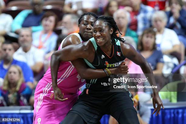 New York Liberty center Tina Charles and Connecticut Sun guard Shekinna Stricklen battle for position during the first half of an WNBA game between...