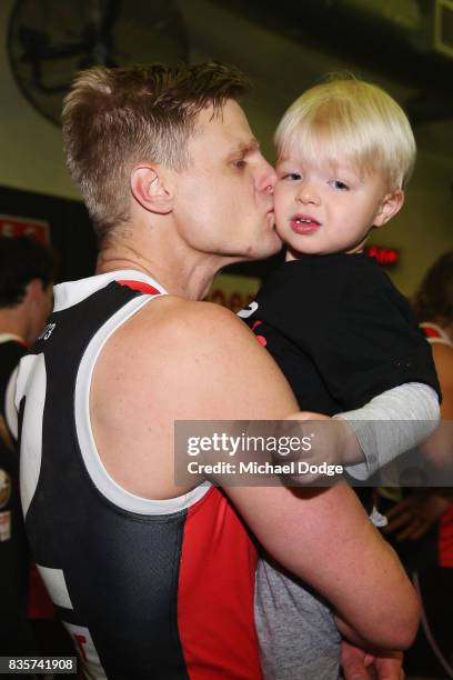 Nick Riewoldt of the Saints kisses his son James after winning during the round 22 AFL match between the St Kilda Saints and the North Melbourne...