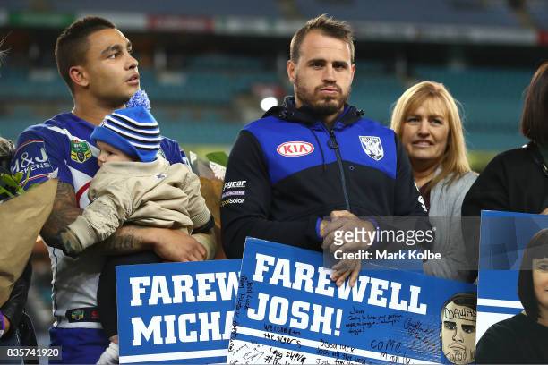 Departing Bulldogs players Michael Lichaa and Josh Reynolds pose on stage after a presentation to the players and officials leaving the club at the...