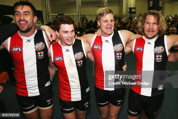 Saints players sing the club song after winning during the round 22 AFL match between the St Kilda Saints and the North Melbourne Kangaroos at Etihad...