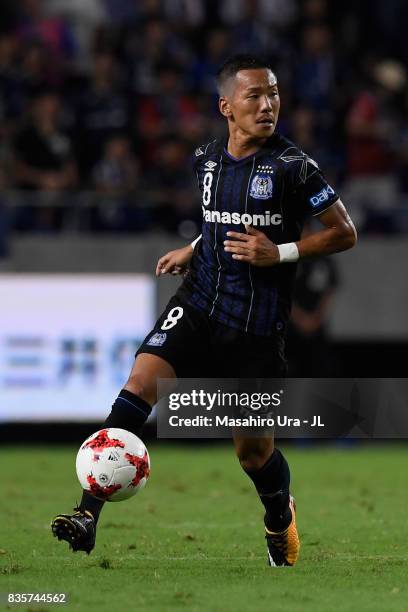 Yosuke Ideguchi of Gamba Osaka in action during the J.League J1 match between Gamba Osaka and Kashiwa Reysol at Suita City Football Stadium on August...