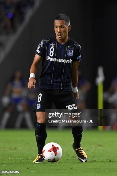 Yosuke Ideguchi of Gamba Osaka in action during the J.League J1 match between Gamba Osaka and Kashiwa Reysol at Suita City Football Stadium on August...