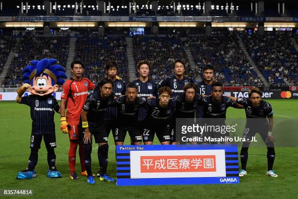 Gamba Osaka players line up for the team photos prior to the J.League J1 match between Gamba Osaka and Kashiwa Reysol at Suita City Football Stadium...