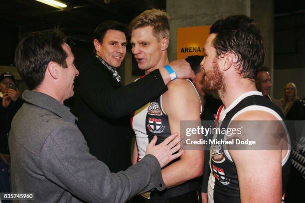 Nick Riewoldt of the Saints celebrates with former teammates Stephen Milne and Justin Koschitzke after winning during the round 22 AFL match between...