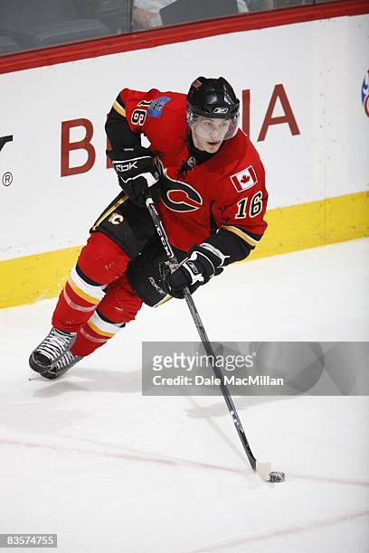 Dustin Boyd of the Calgary Flames skates with the puck during the game against the Colorado Avalanche on October 28, 2008 at the Pengrowth Saddledome...