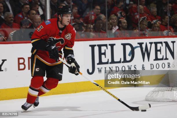 Dion Phaneuf of the Calgary Flames skates with the puck during the game against the Colorado Avalanche on October 28, 2008 at the Pengrowth...