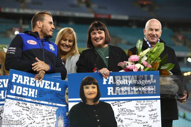 Departing Bulldogs player Josh Reynolds and CEO Raelene Castle stand on stage after a presentation to the players and officials leaving the club at...