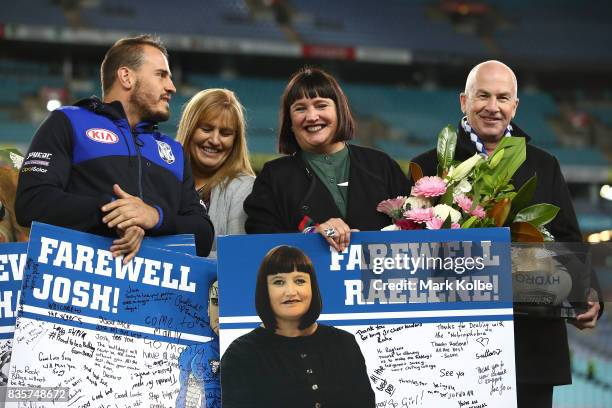 Departing Bulldogs player Josh Reynolds and CEO Raelene Castle stand on stage after a presentation to the players and officials leaving the club at...