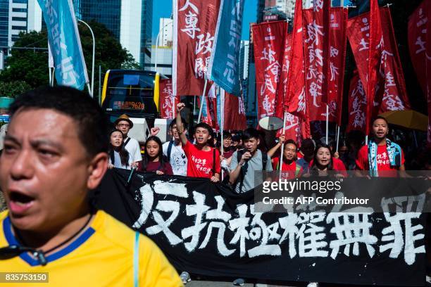 Protesters march in Hong Kong on August 20 to protest the jailing of Joshua Wong, Nathan Law and Alex Chow , the leaders of Hong Kong's 'Umbrella...