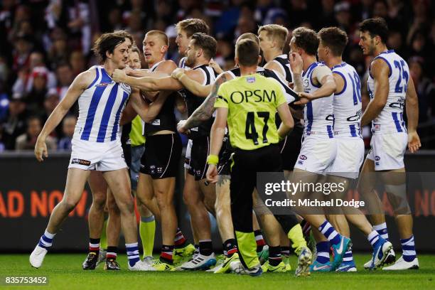 Taylor Garner of the Kangaroos wrestles with Maverick Weller of the Saints during the round 22 AFL match between the St Kilda Saints and the North...