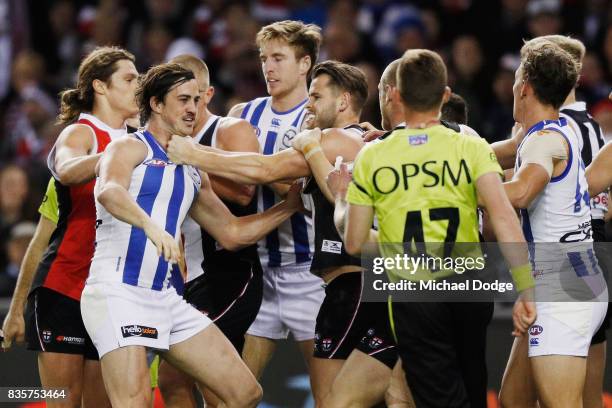 Taylor Garner of the Kangaroos wrestles with Maverick Weller of the Saints during the round 22 AFL match between the St Kilda Saints and the North...