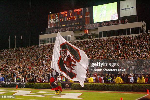 General view of the South Carolina Gamecocks mascot running the flag on the field during the game against the Tennessee Volunteers at Williams-Brice...