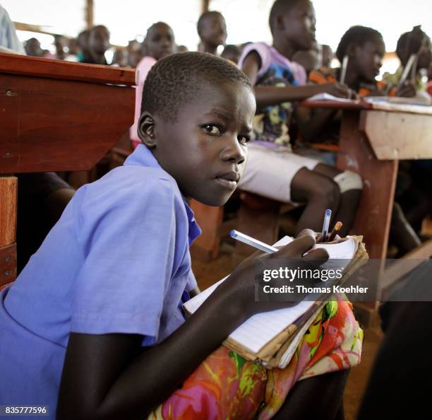 Rhino, Uganda An Portrait of a student while teaching in a school at Rhino Refugee Camp Settlement in northern Uganda. Here, children of local people...