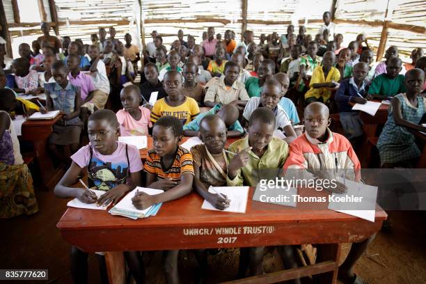 Rhino, Uganda Group of students in a school at the Rhino Refugee Camp Settlement in northern Uganda. Here, children of local people and refugees are...
