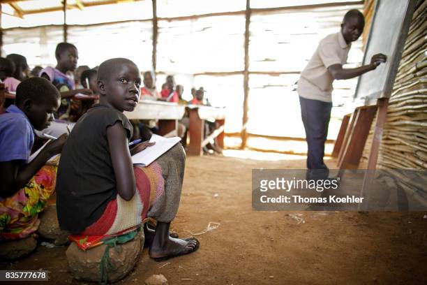Students during the lessons in a school at the Rhino Refugee Camp Settlement in northern Uganda. Here, children of local people and refugees are...
