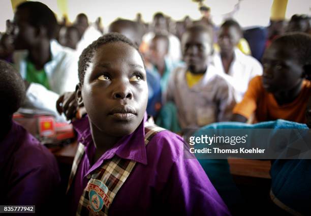 Student in a school at the Rhino Refugee Camp Settlement in northern Uganda. Here, children of local people and refugees are taught together. The...
