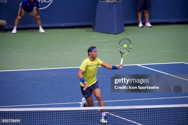 Rafael Nadal of Spain serves hits a volley during a match in the Western & Southern Open at the Lindner Family Tennis Center in Cincinnati, OH.