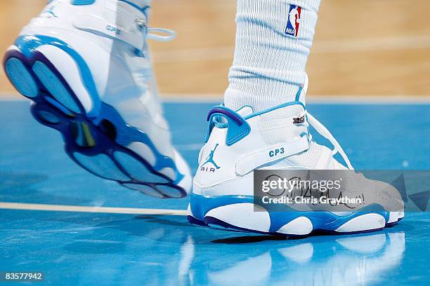 Chris Paul of the New Orleans Hornets has the name of President-elect Barack Obama written on his shoes during the game against the Atlanta Hawks at...