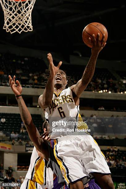 Marquis Daniels of the Indiana Pacers shoots over a Phoenix Suns defender at Conseco Fieldhouse on November 5, 2008 in Indianapolis, Indiana. The...