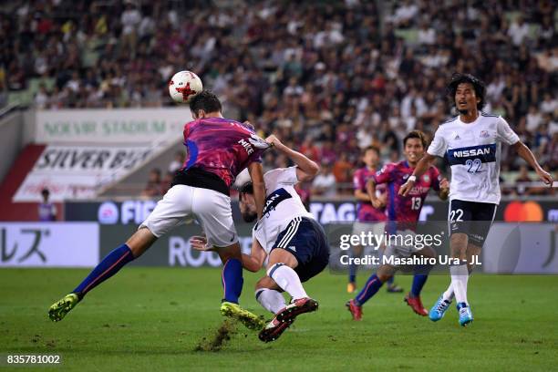 Mike Havenaar of Vissel Kobe is challenged by Milos Degenek of Yokohama F.Marinos in the penalty area during the J.League match between Vissel Kobe...