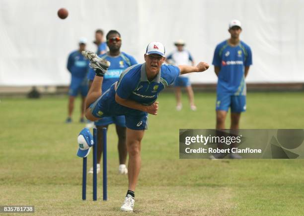 Mitchell Swepson of Australia bowls during an Australian Test team nets session at Sher-E Bangla National Cricket Stadium Cricket Stadium on August...