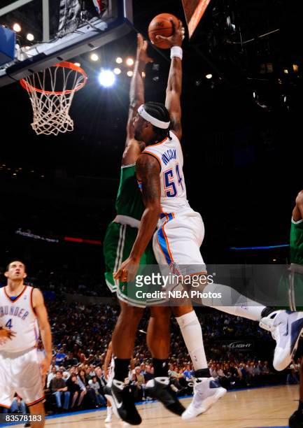 Chris Wilcox of the Oklahoma City Thunder goes up for a slam dunk against Glen Davis of the Boston Celtics at the Ford Center on November 5, 2008 in...