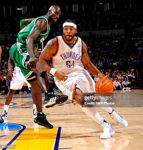 Chris Wilcox of the Oklahoma City Thunder dribbles around Kevin Garnett of the Boston Celtics at the Ford Center on November 5, 2008 in Oklahoma...