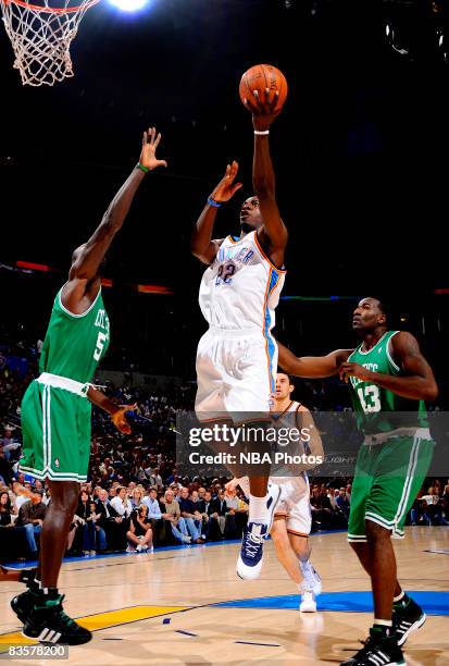 Jeff Green of the Oklahoma City Thunder goes to the basket against Kevin Garnett and Kendrick Perkins of the Boston Celtics at the Ford Center on...