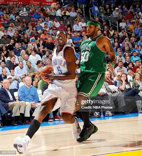 Kyle Weaver of the Oklahoma City Thunder drives to the basket while being guarded by Eddie House of the Boston Celtics at the Ford Center on November...