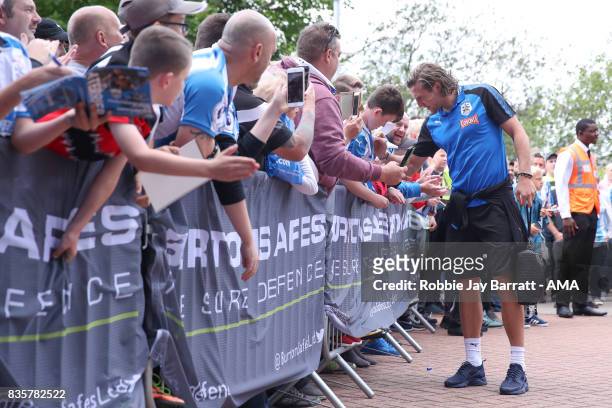 Michael Hefele of Huddersfield Town signs autographs for fans prior to the Premier League match between Huddersfield Town and Newcastle United at...
