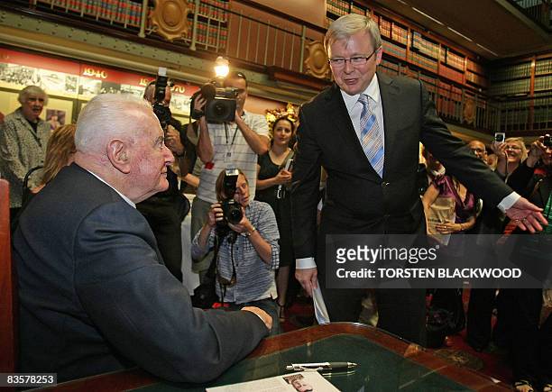 Australian Prime Minister Kevin Rudd congratulates former prime minister Gough Whitlam during the launch of his biograghy at Parliament House in...