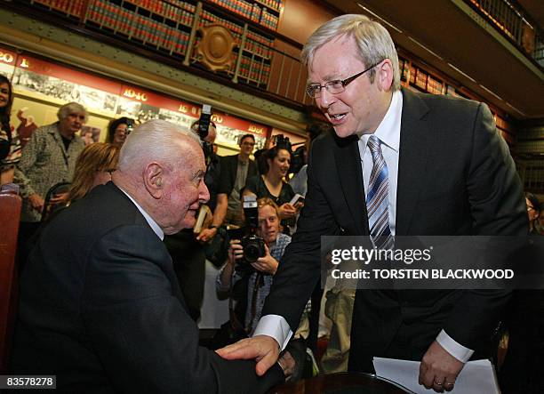 Australian Prime Minister Kevin Rudd congratulates former prime minister Gough Whitlam during the launch of his biography at Parliament House in...