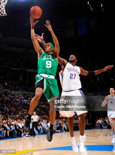 Rajon Rondo of the Boston Celtics goes to the basket against Johan Petro of the Oklahoma City Thunder at the Ford Center on November 5, 2008 in...
