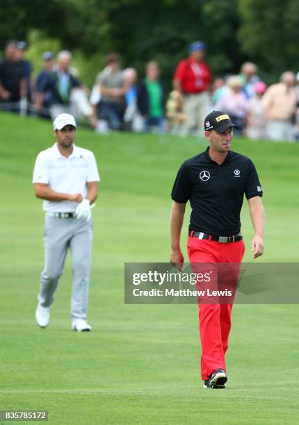 Adrian Otaegui of Spain and Marcel Siem of Germany walk down the 3rd hole during the final match of the Saltire Energy Paul Lawrie Matchplay at Golf...