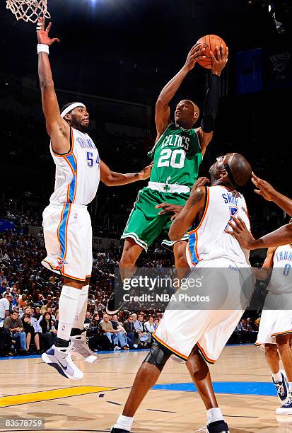 Ray Allen of the Boston Celtics goes up for a shot shot against Chris Wilcox and Joe Smith of the Oklahoma City Thunder at the Ford Center on...