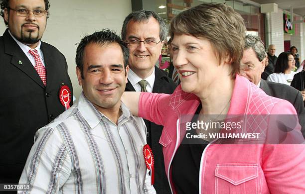New Zealand's Labour Prime Minister Helen Clark greets former New Zealand rugby league great Stacey Jones who has endorsed her party, during a tour...