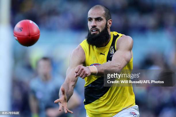 Bachar Houli of the Tigers handpasses the ball during the round 22 AFL match between the Fremantle Dockers and the Richmond Tigers at Domain Stadium...