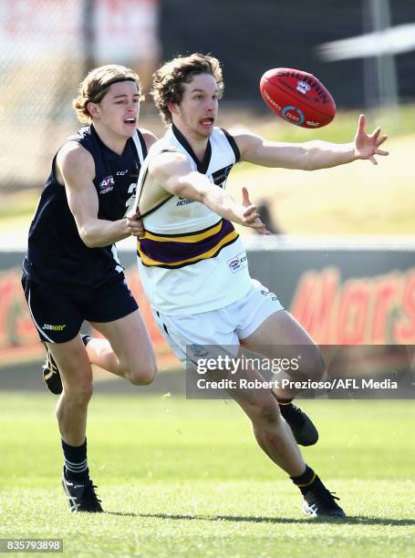 Ryan Bruce of the Murray Bushrangers gathers the ball during the TAC Cup round 16 match between the Geelong Falcons and the Murray Bushrangers at...