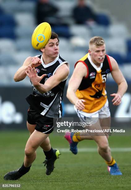 Flynn Appleby of the Greater Western Victoria Rebels handballs during the TAC Cup round 16 match between the Greater Western Victoria Rebels and the...