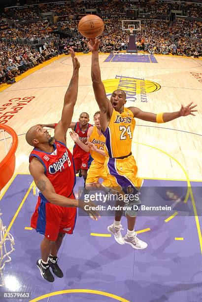 Kobe Bryant of the Los Angeles Lakers attempts a shot over Brian Skinner of the Los Angeles Clippers at Staples Center on November 5, 2008 in Los...